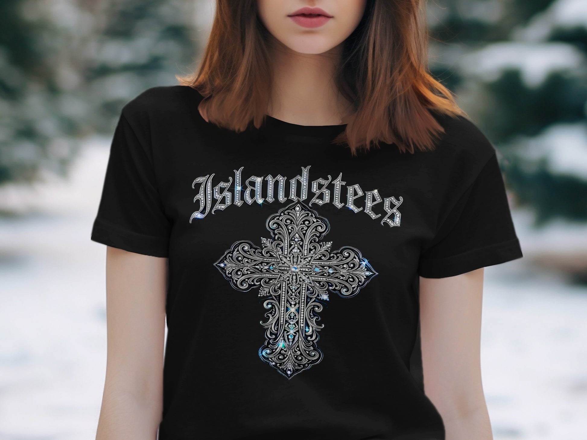 Black t-shirt with ornate silver cross and "Islandstees" text.