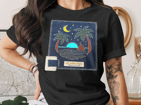 Black t-shirt with a denim patch featuring palm trees, sunset, and boat.