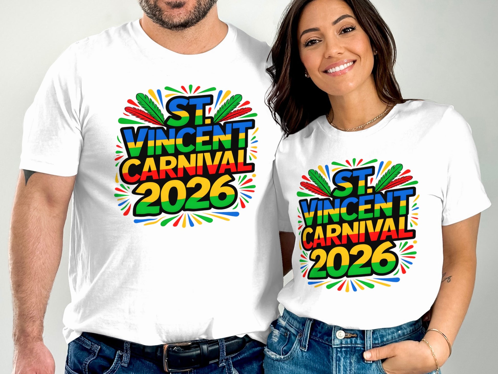 Two people wearing white t-shirts with "ST. VINCENT CARNIVAL 2026" text and colorful feather design.
