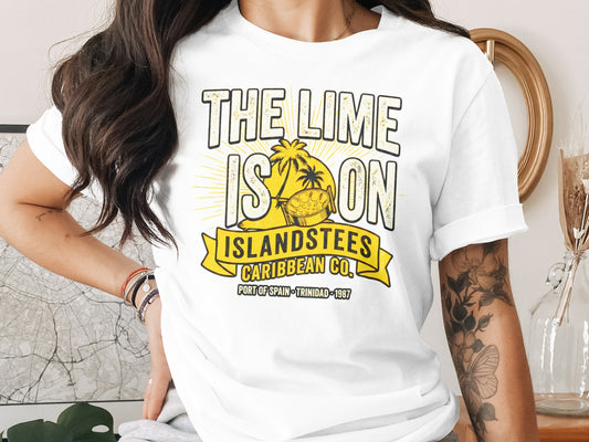 White t-shirt with "THE LIME IS ON ISLANDSTEES" text and a palm tree.