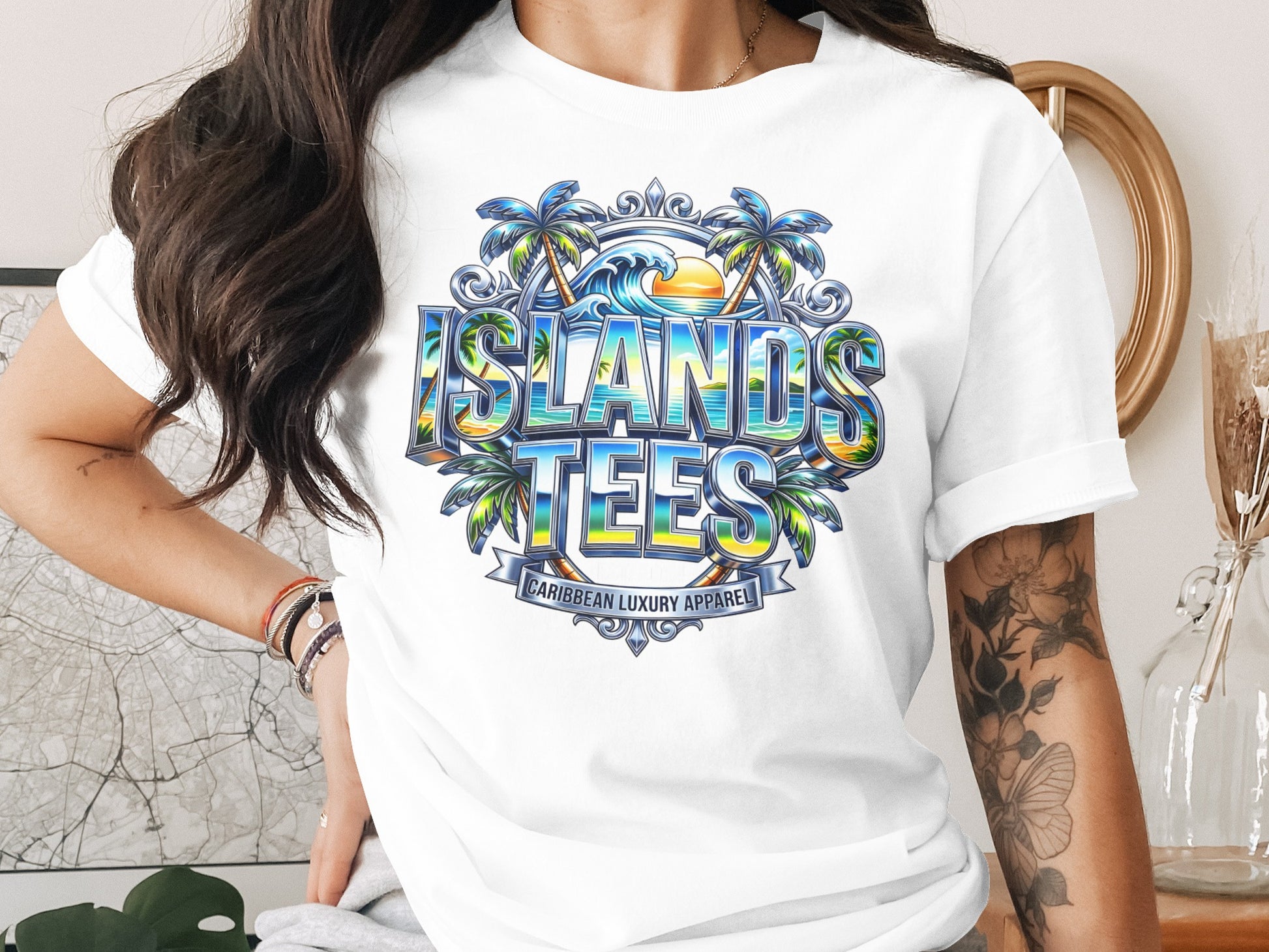 White t-shirt with "ISLANDS TEES" logo featuring palm trees, ocean waves, and sunset.