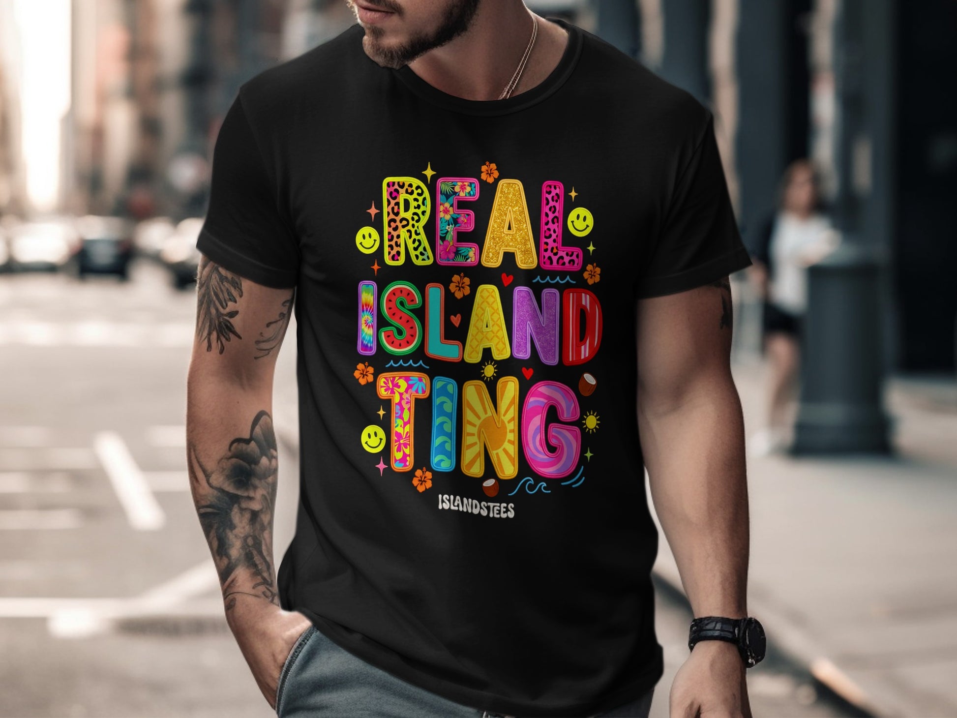 Black t-shirt with colorful "Real Island Ting" text and playful graphics.