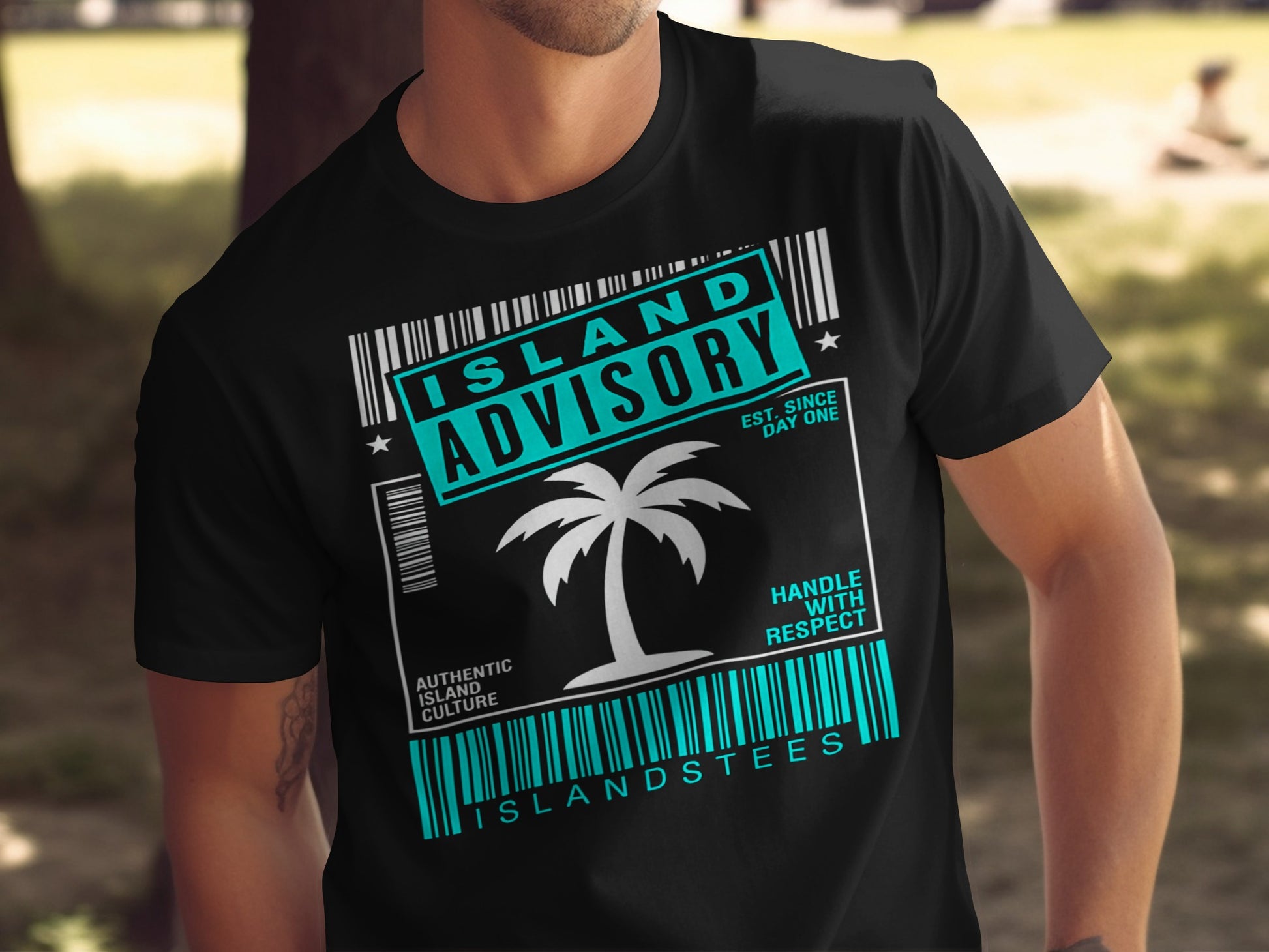Black t-shirt with palm tree and text "ISLAND ADVISORY EST. SINCE DAY ONE".