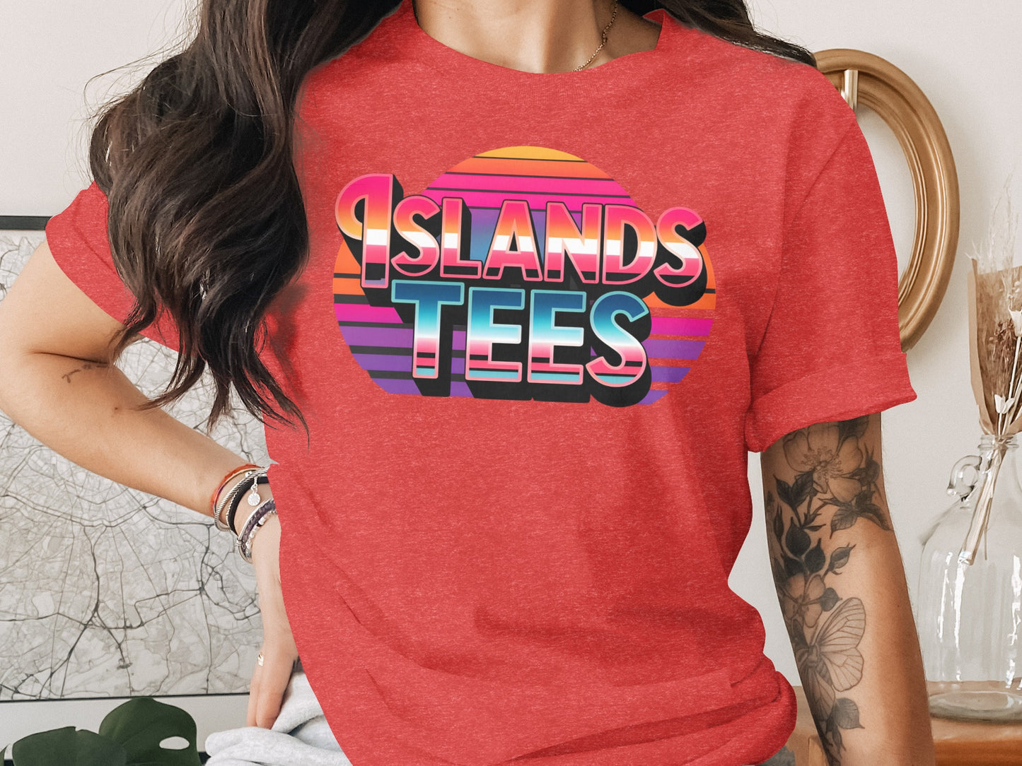 Red t-shirt with "Islands Tees" in colorful gradient text.