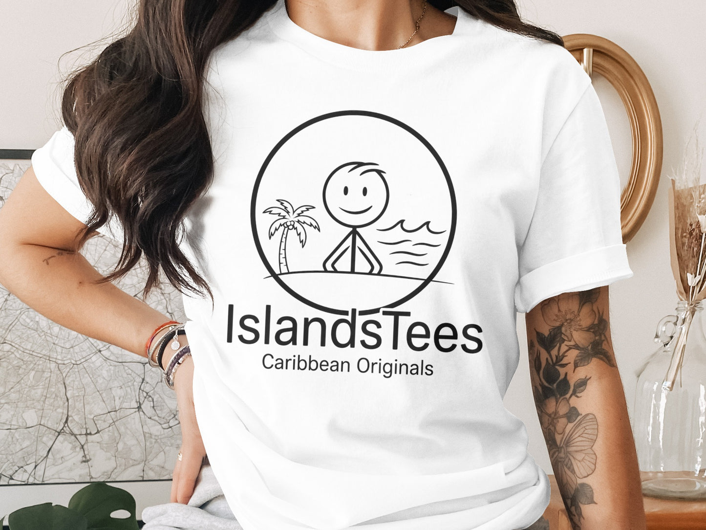 T-shirt with IslandsTees Caribbean Originals logo featuring stick figure and palm tree.