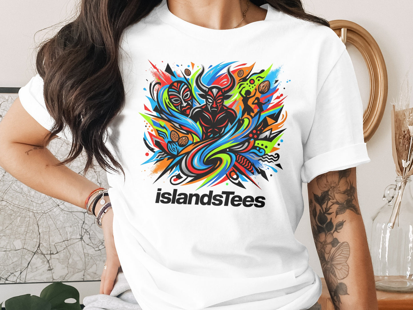 White t-shirt with colorful abstract tribal design and "islandsTees" logo.