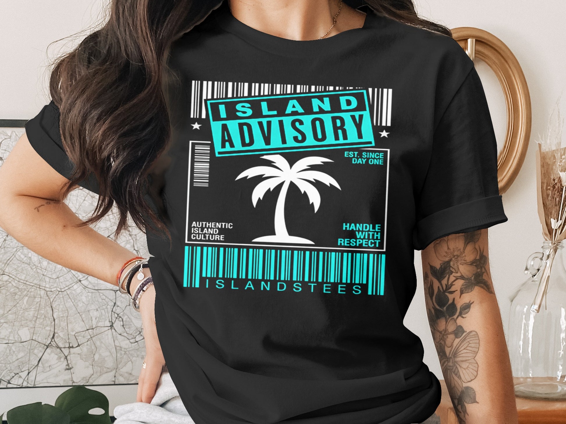 Black t-shirt with "Island Advisory" and palm tree graphic.