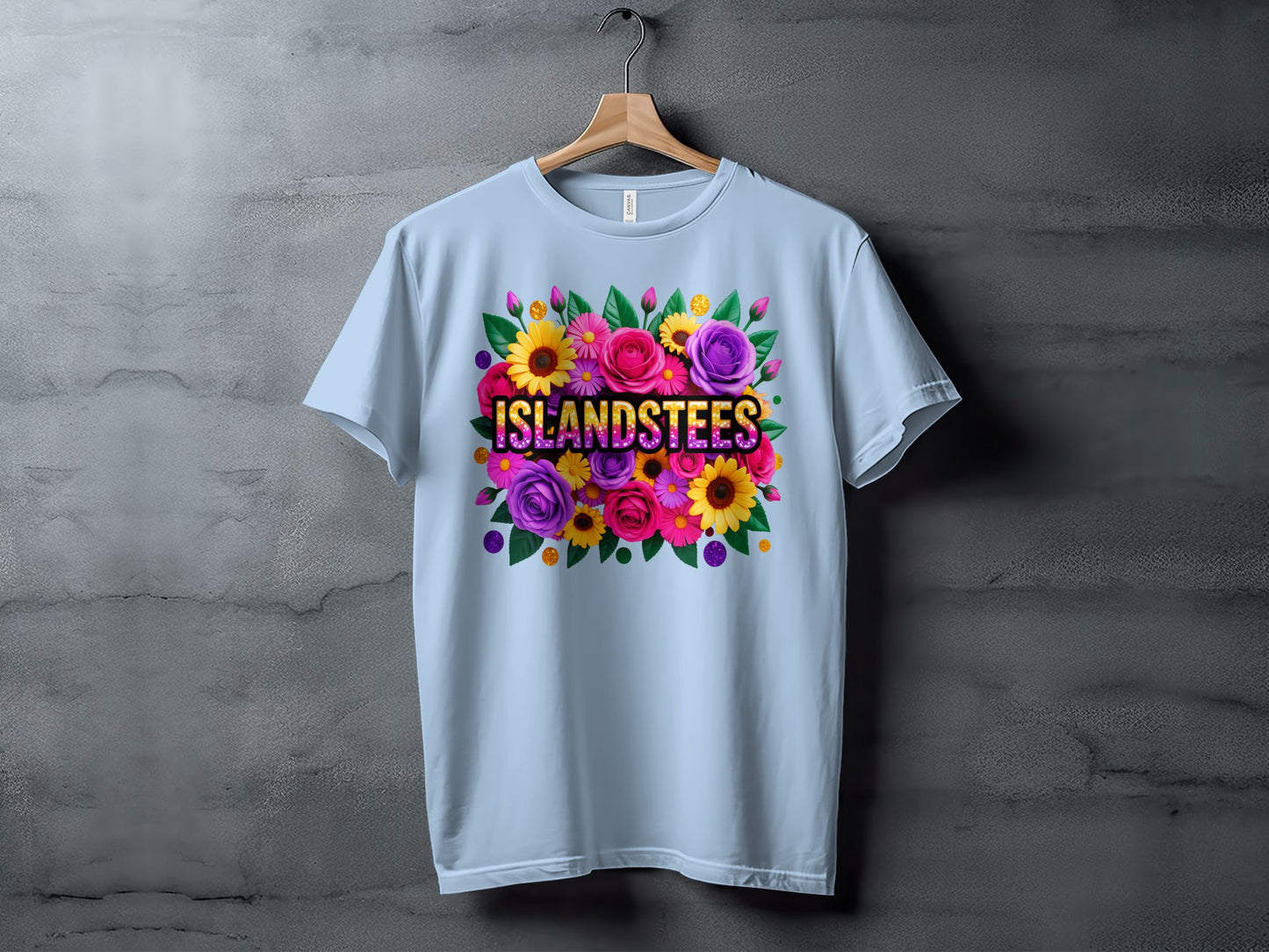 Light blue t-shirt with colorful floral design and "ISLANDSTEES" text.