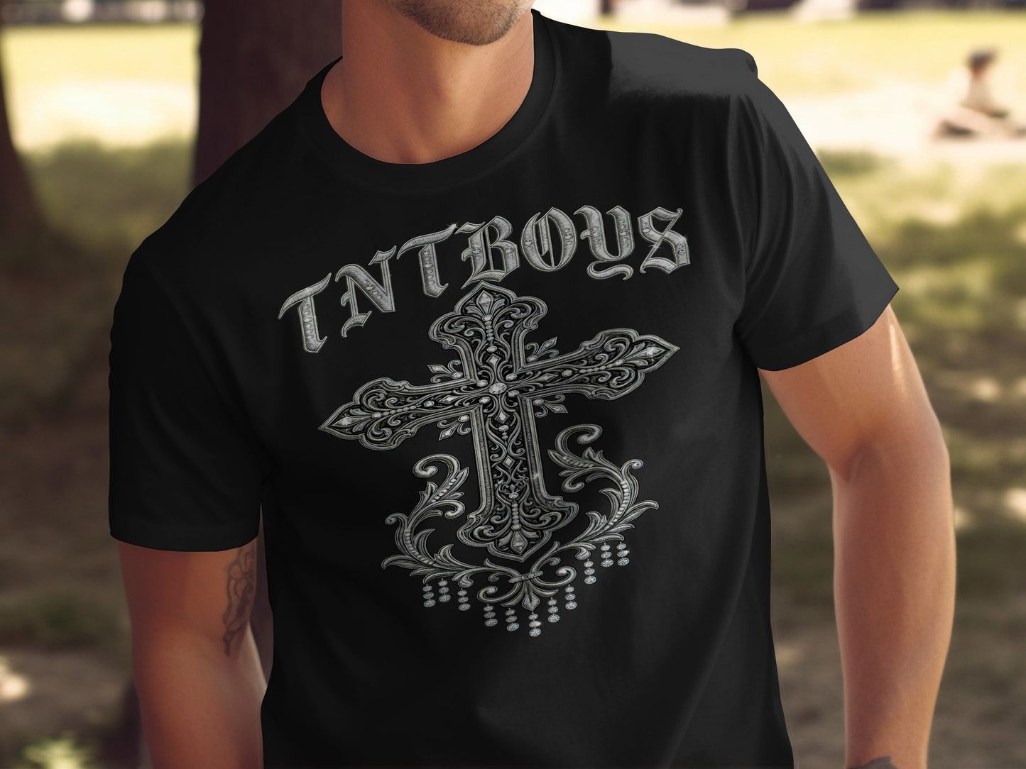 Black t-shirt with ornate silver cross and "TNTBOYS" text.