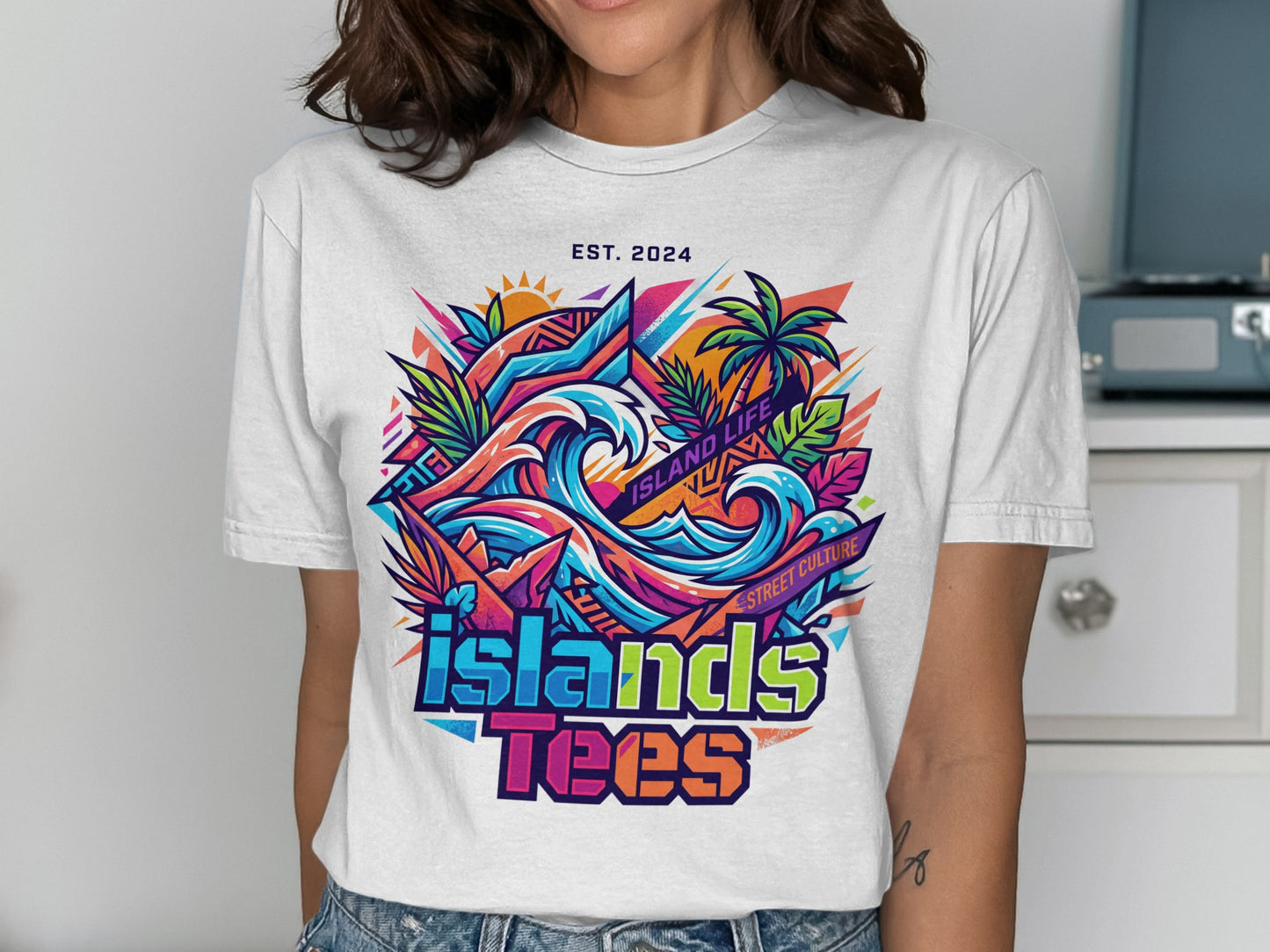 Graphic tee with colorful island waves, palm trees, and text "ISLANDS TEES".