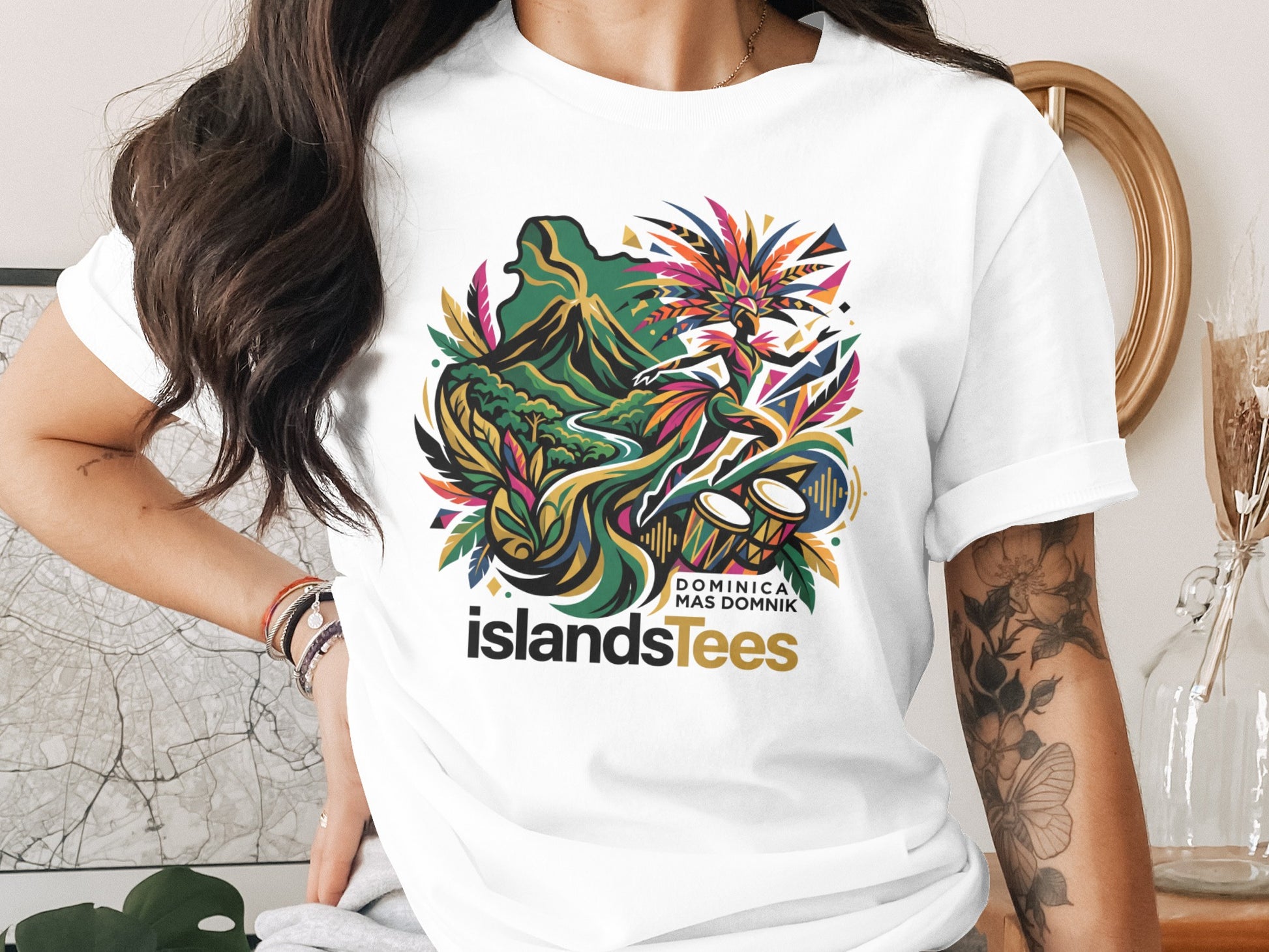 T-shirt with colorful island landscape, dancer, drums, and text "DOMINICA MAS DOMINIK".