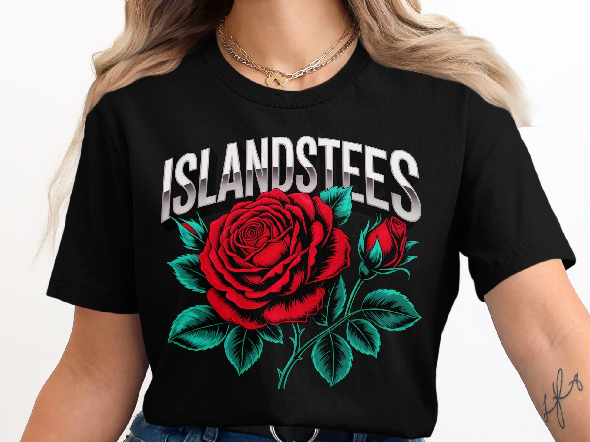 Black t-shirt with "Islandstees" text and a red rose design.