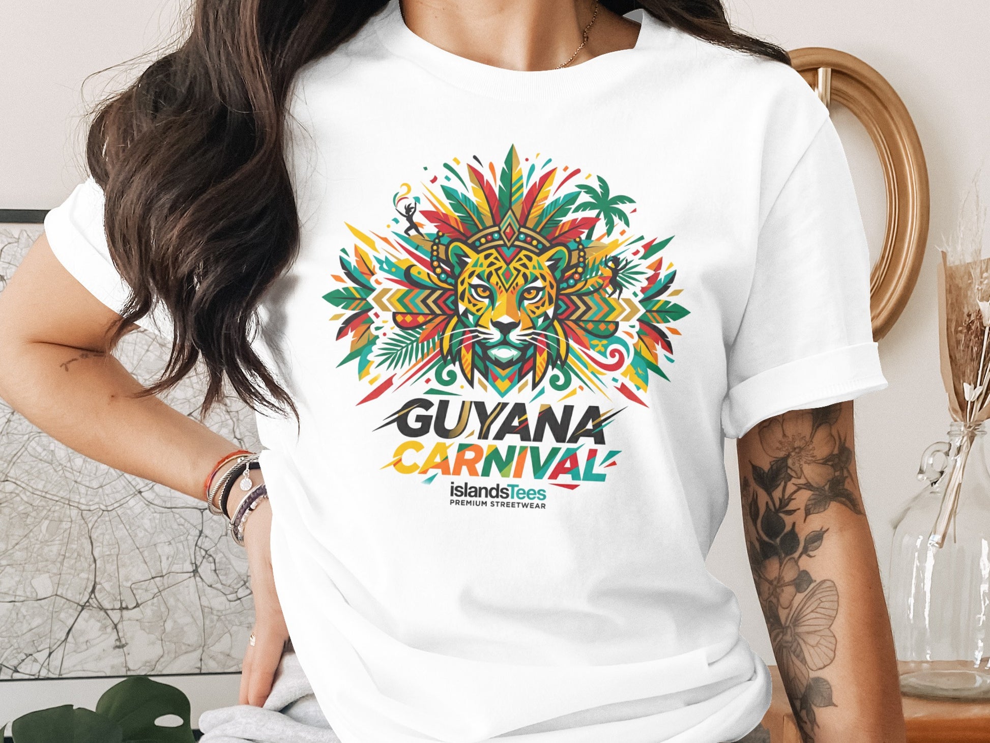 White t-shirt with "Guyana Carnival" graphic featuring a colorful jaguar and tropical foliage.
