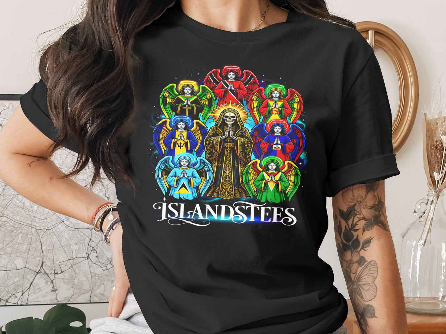 T-shirt with angels and a skeleton figure, featuring text "ISLANDSTEES".