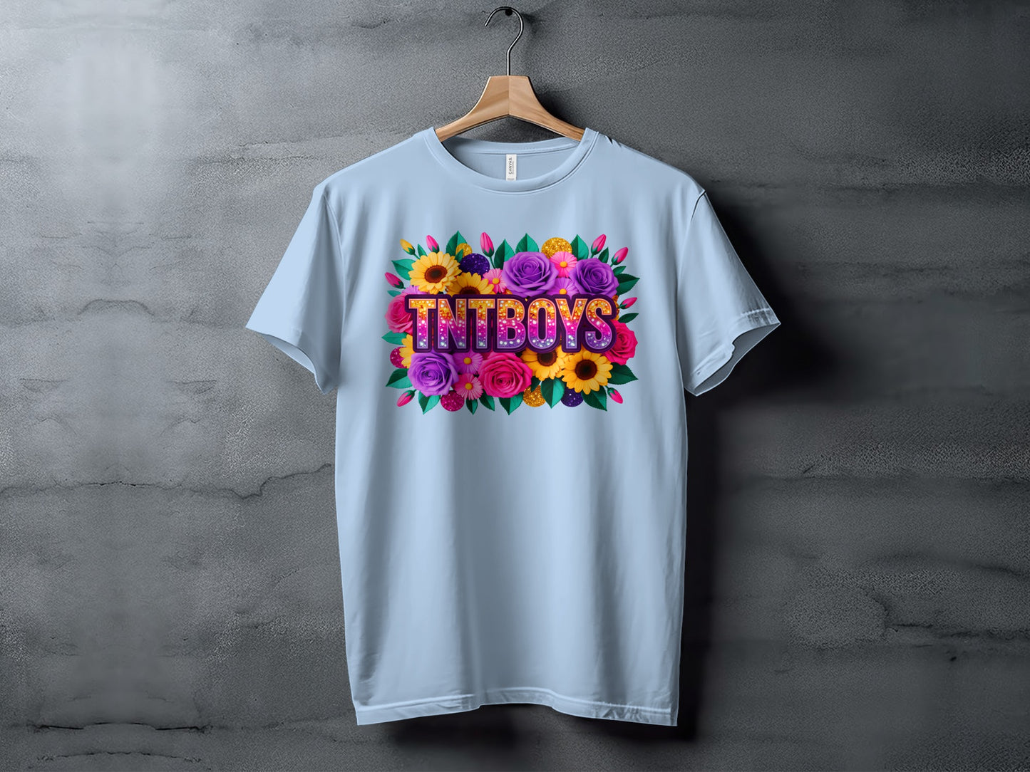 Light blue t-shirt with "TNT BOYS" text art surrounded by colorful flowers.