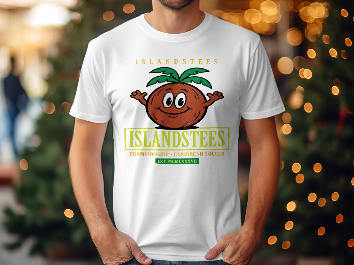 White t-shirt with a cartoon coconut character and "Islandstees Championship Caribbean Soccer" text.