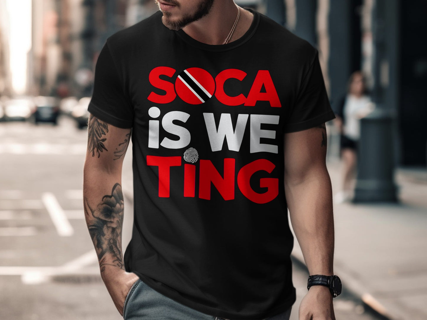 Black t-shirt with "SOCA IS WE TING" in red and white lettering, flag accents.