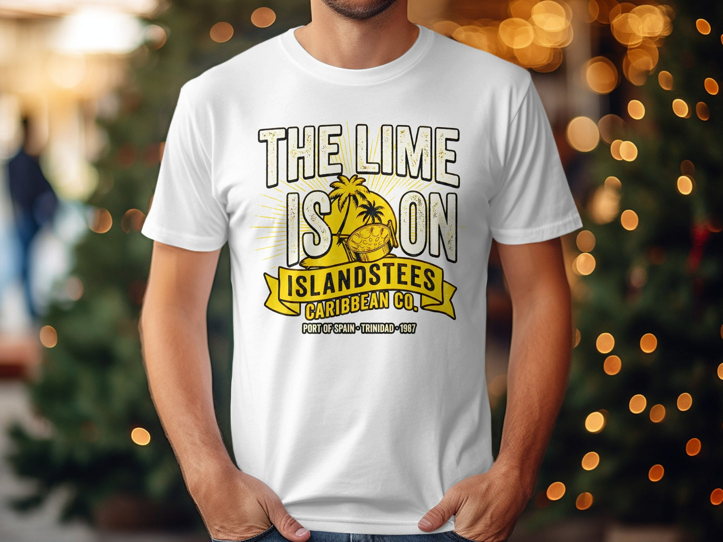 White t-shirt with yellow text and palm tree graphic: "THE LIME IS ON ISLANDSTEES CARIBBEAN CO."