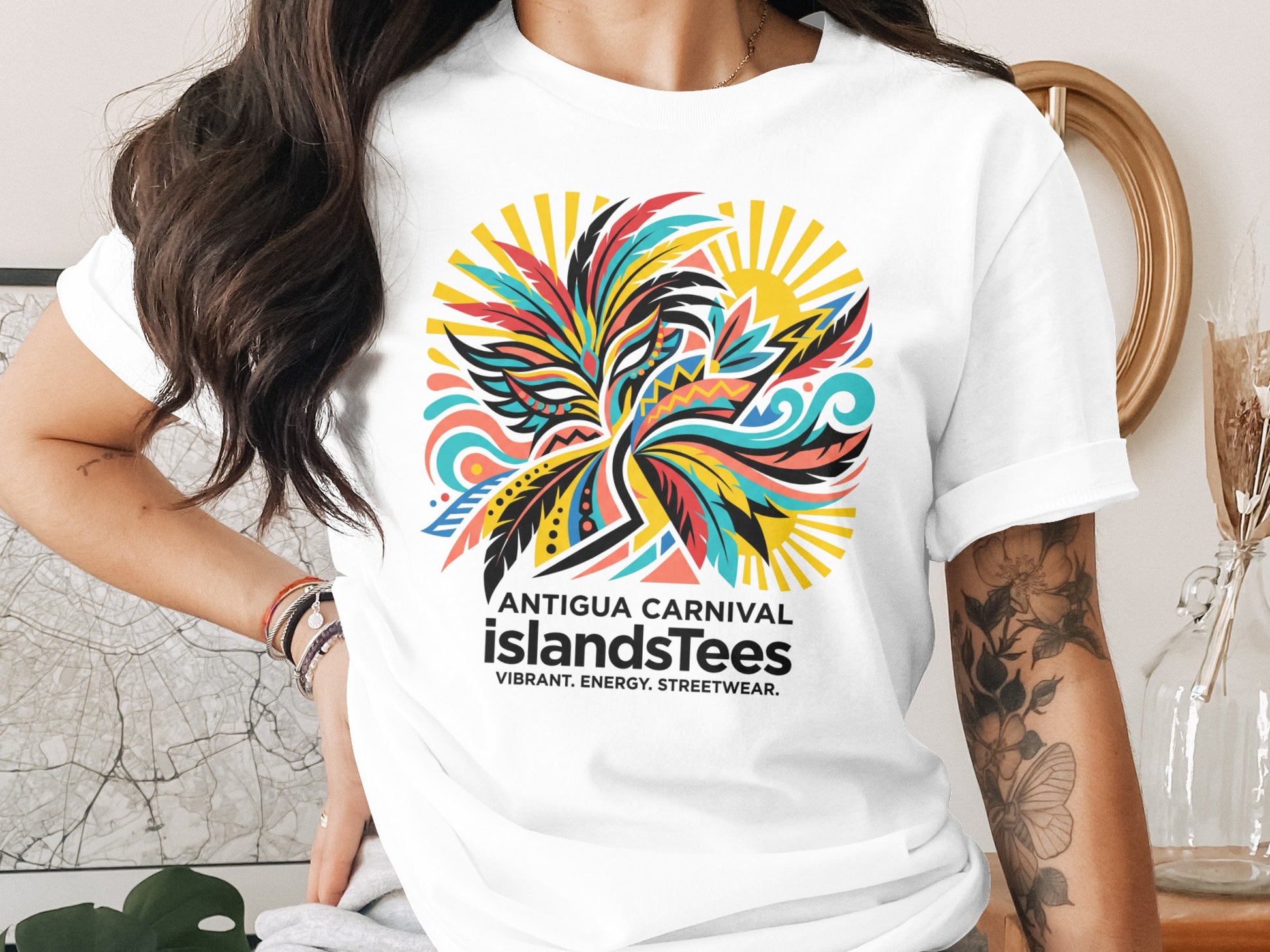 Antigua Carnival IslandsTees logo with bird and sun graphic on a white t-shirt.