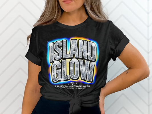 Black t-shirt with "ISLAND GLOW" in sparkly, colorful letters.