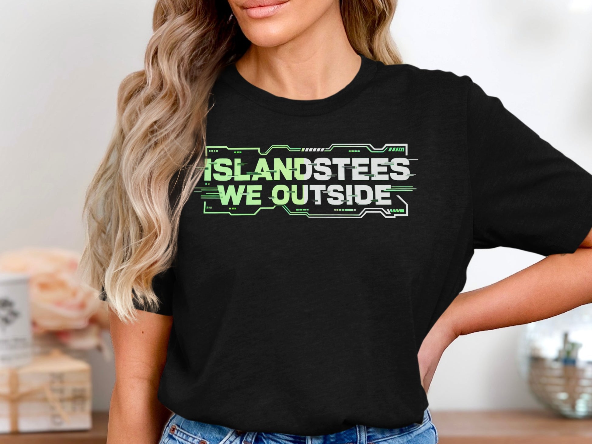 Black t-shirt with "ISLANDSTEES WE OUTSIDE" in neon green text.