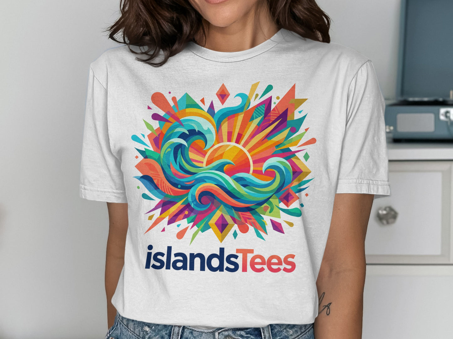 White t-shirt with colorful abstract wave, sun, and geometric design.