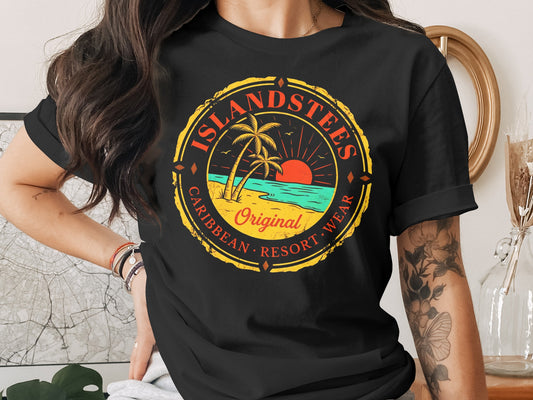 Black t-shirt with "Islandstees Caribbean Resort Wear" graphic of sunset over ocean.