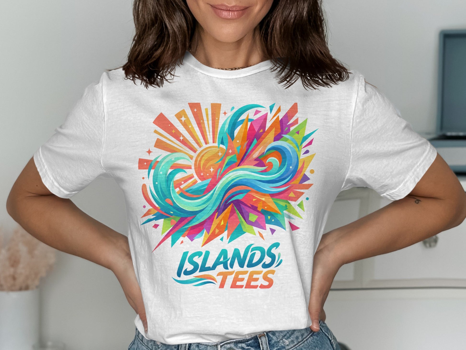 White t-shirt with colorful abstract sun and wave graphic and "ISLANDS TEES" text.