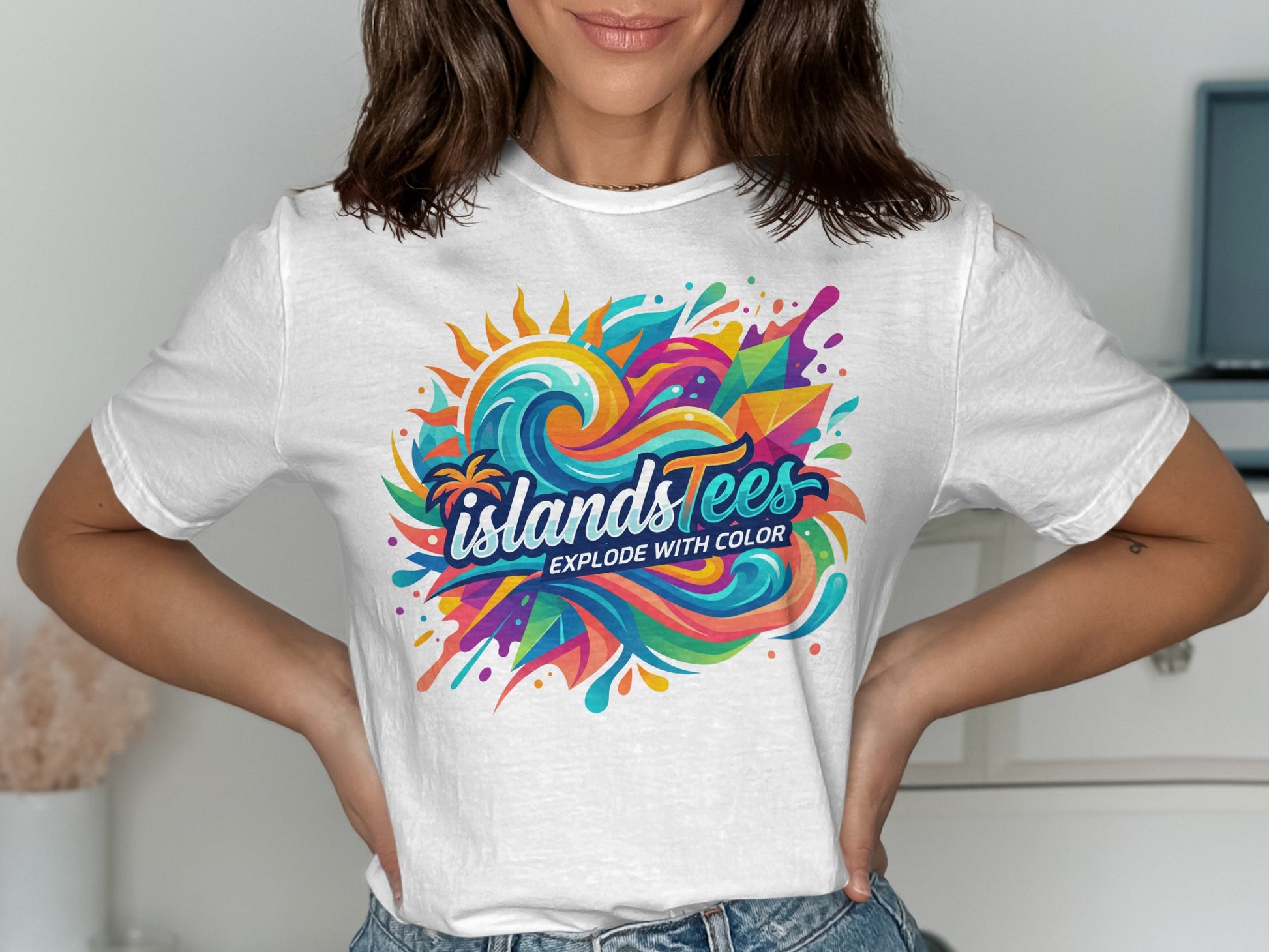 White t-shirt with colorful "ISLANDS EXPLODE WITH COLOR" graphic.