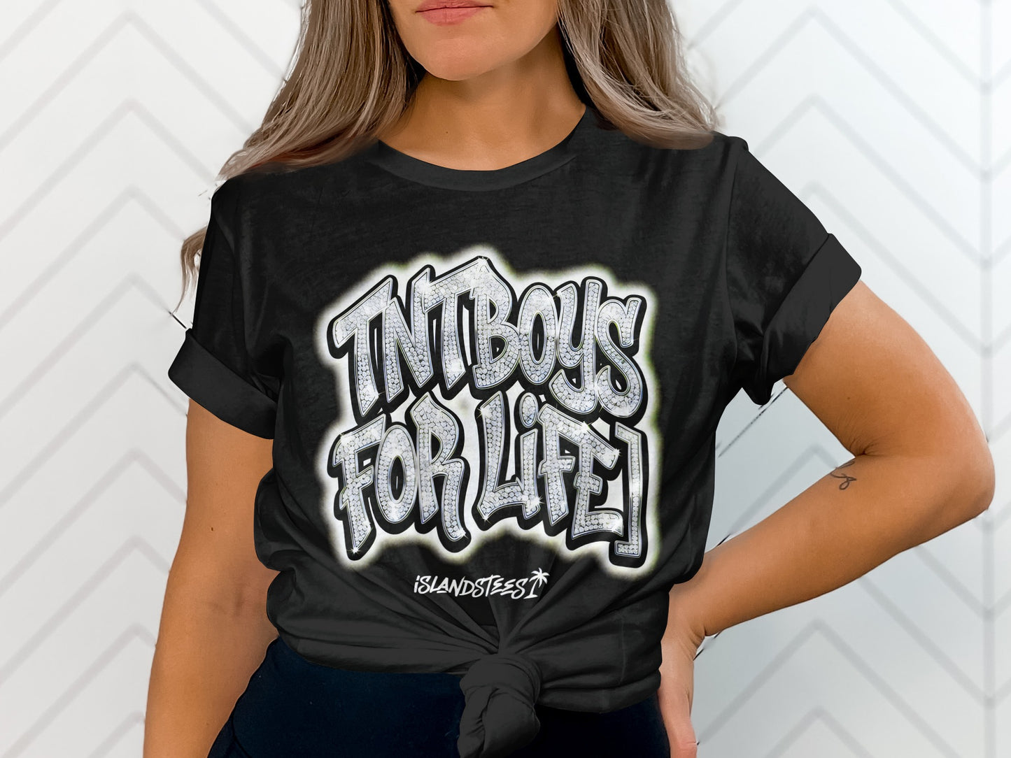 Black t-shirt with white graffiti-style text "TNTBOYS FOR LIFE" and "ISLANDSTEES".