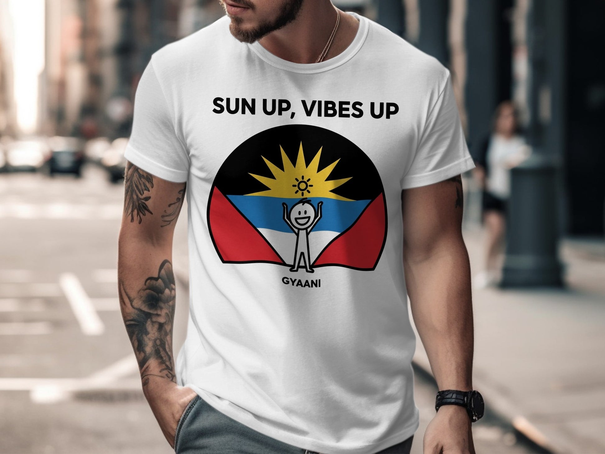 White t-shirt with "SUN UP, VIBES UP" and a stylized sun over the Antigua and Barbuda flag.