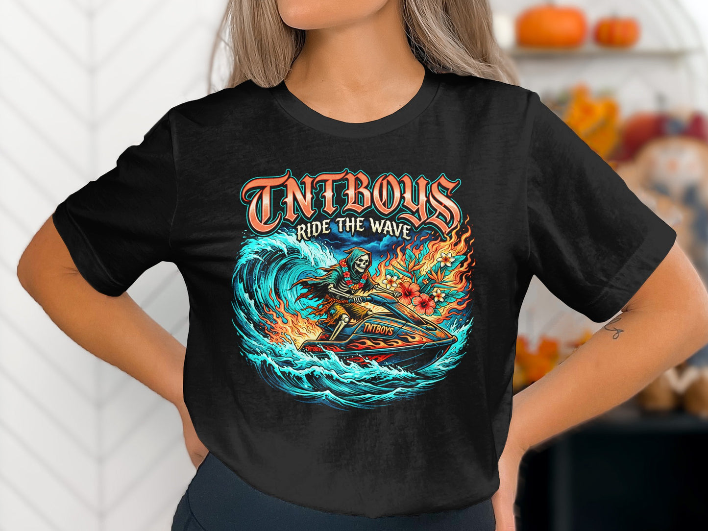 Black t-shirt with "TNTBOYS Ride the Wave" skeleton on jet ski graphic.