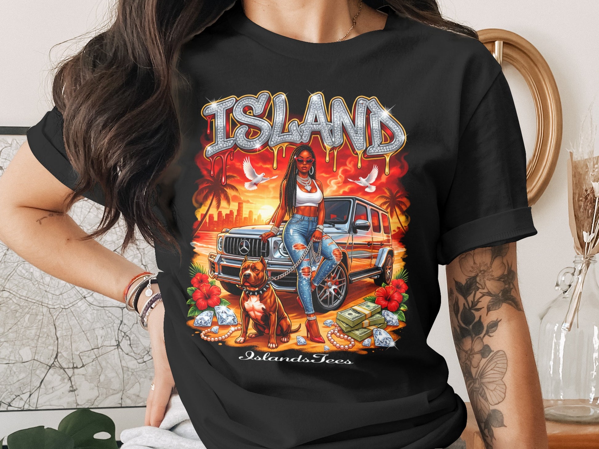 Black t-shirt with "ISLAND" text, woman, dog, and car graphic.
