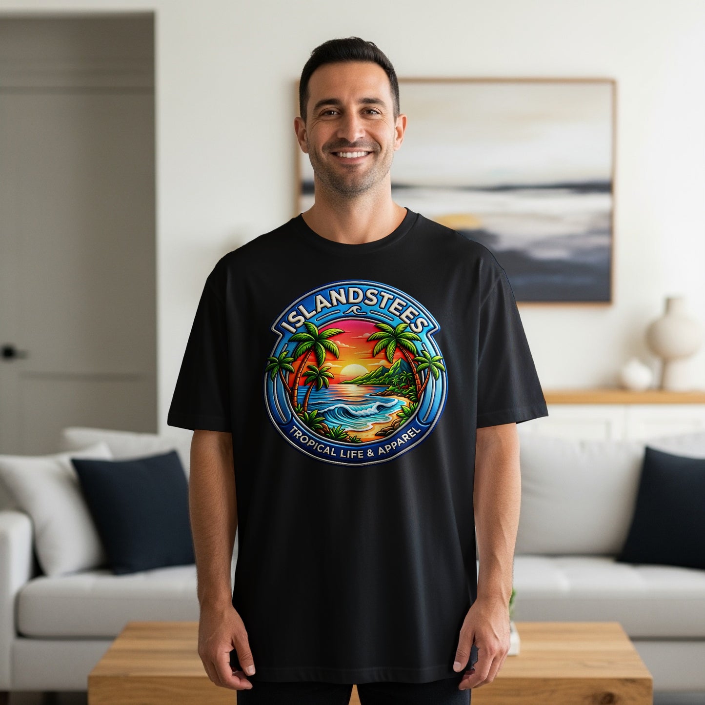 Black t-shirt with a circular logo depicting a tropical beach scene and the text "Islandstees Tropical Life & Apparel".