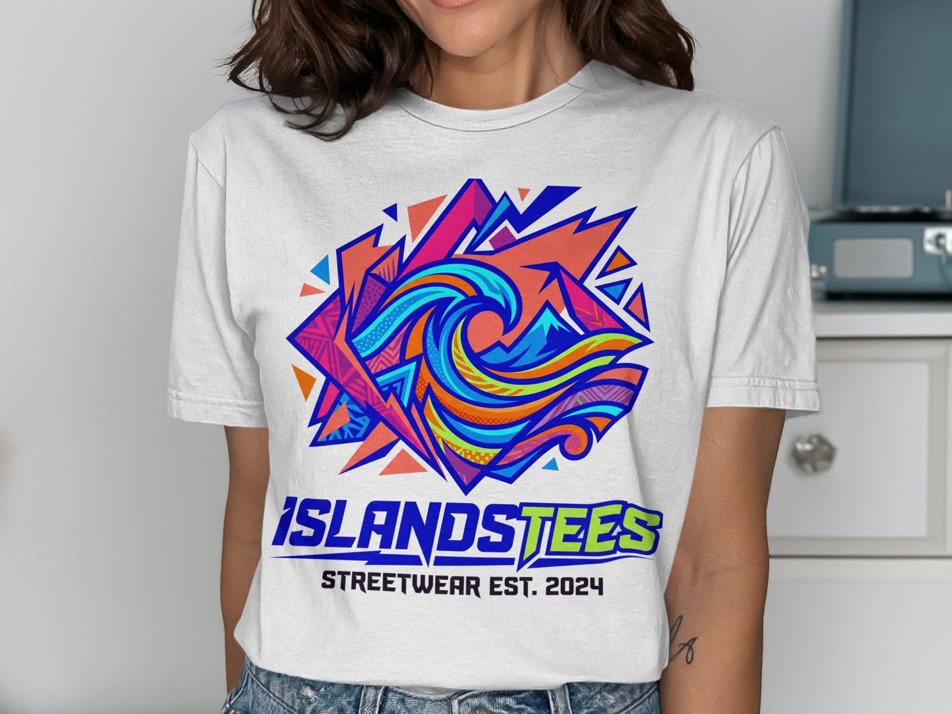 White t-shirt with colorful abstract wave logo and "ISLANDSTEES STREETWEAR EST. 2024".