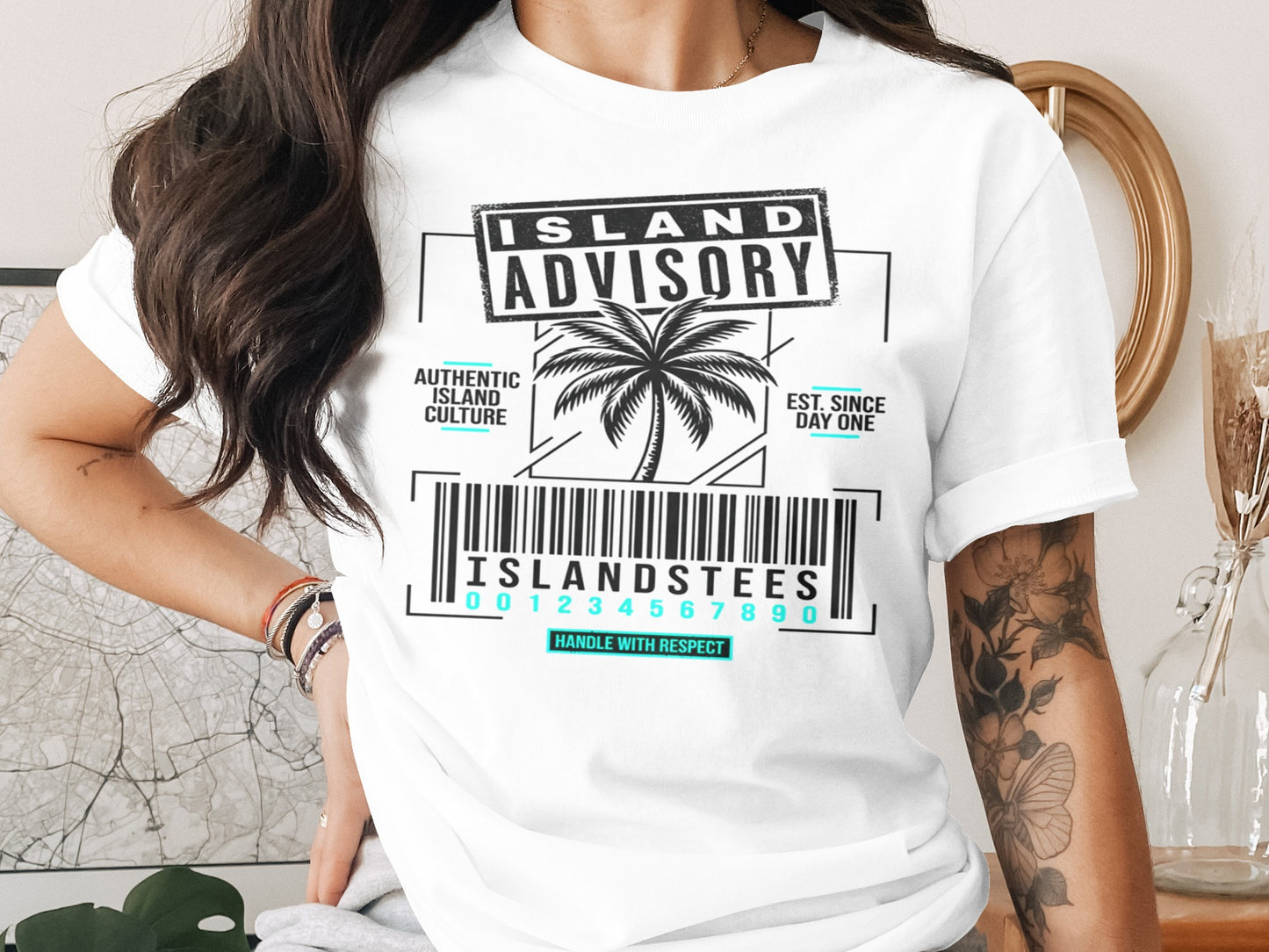 White t-shirt with "Island Advisory" text, palm tree, barcode, and "Handle With Respect."
