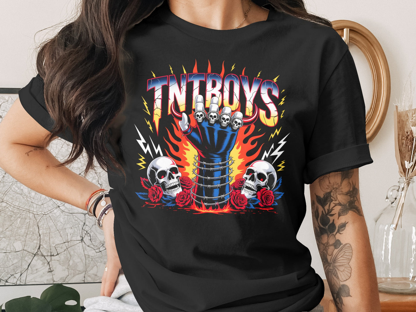Black t-shirt with "TNT BOYS" logo, fiery hand, skulls, and roses.