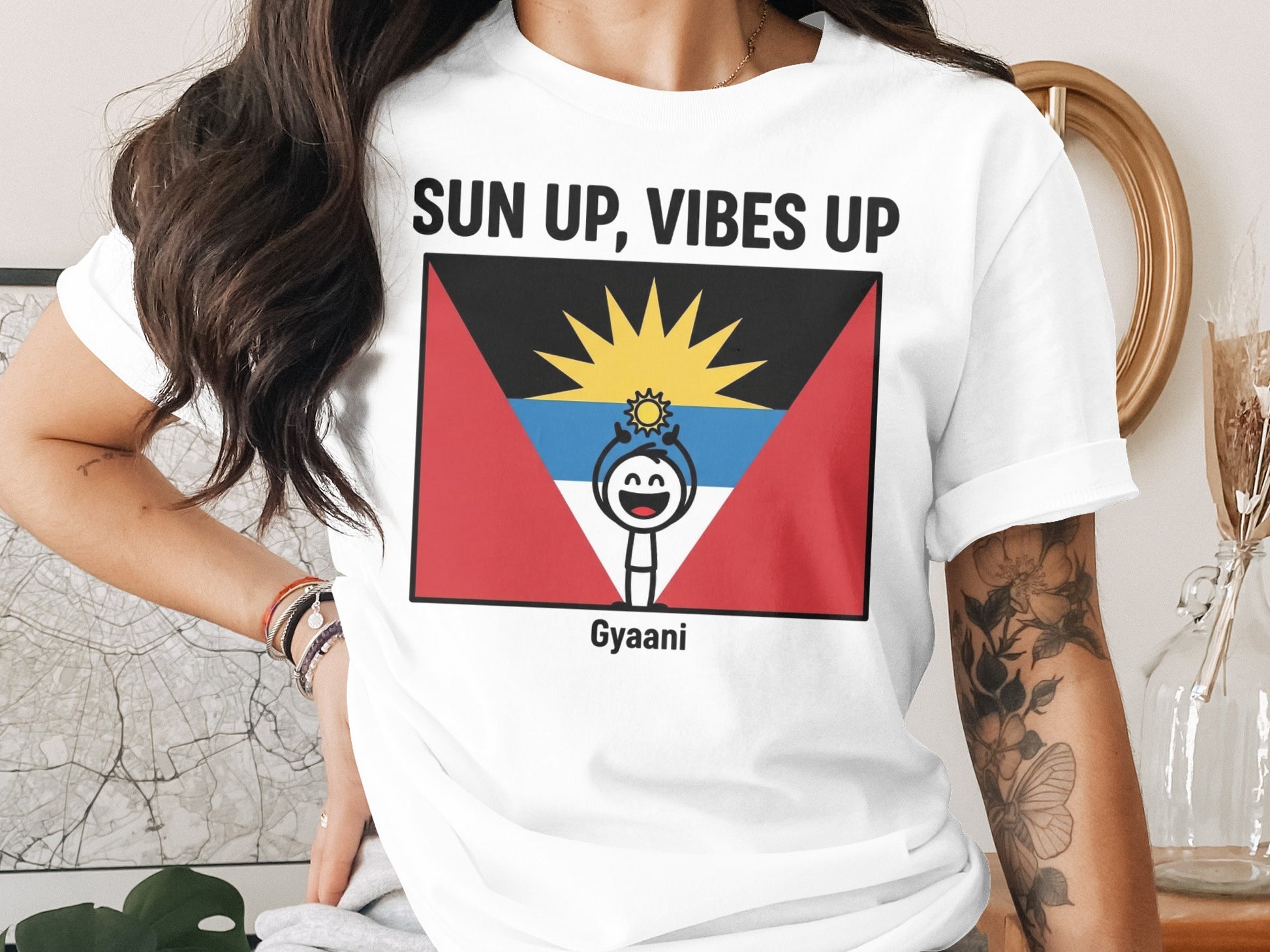 White t-shirt with flag design and text "SUN UP, VIBES UP Gyaani".
