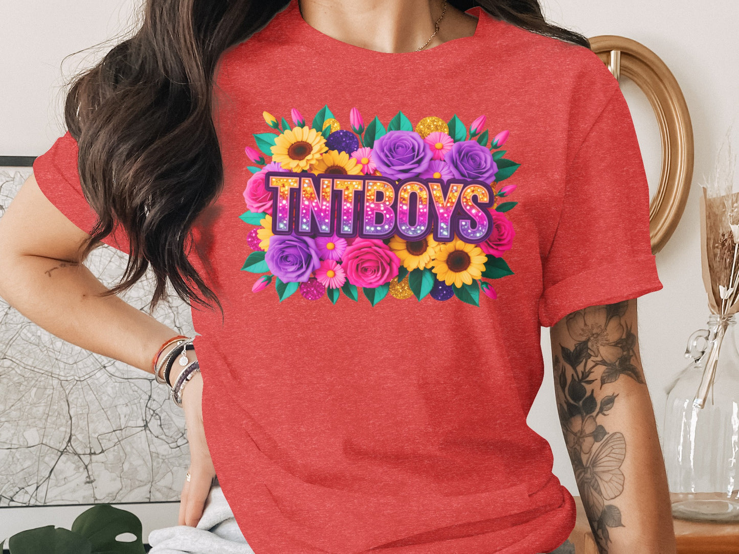 Red t-shirt with "TNTBOYS" in glittery floral lettering.
