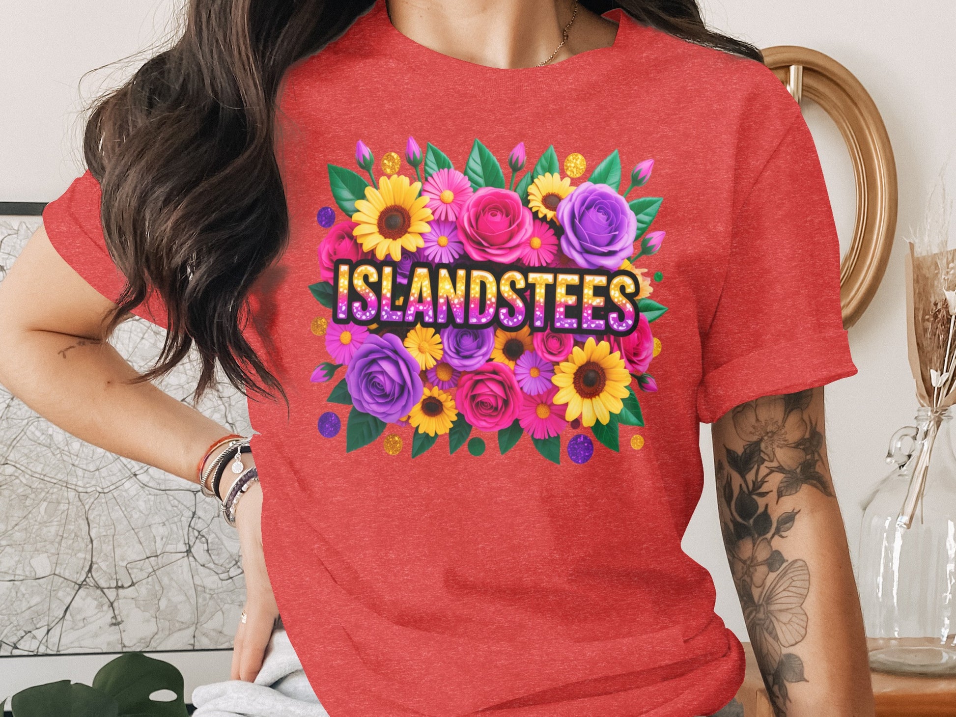Red t-shirt with colorful floral design and "ISLANDSTEES" text.