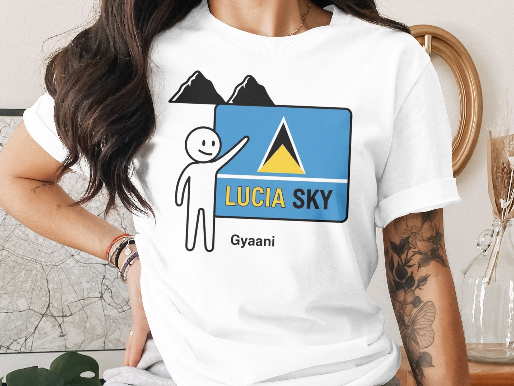 White t-shirt with "LUCIA SKY" and Saint Lucia flag graphic.