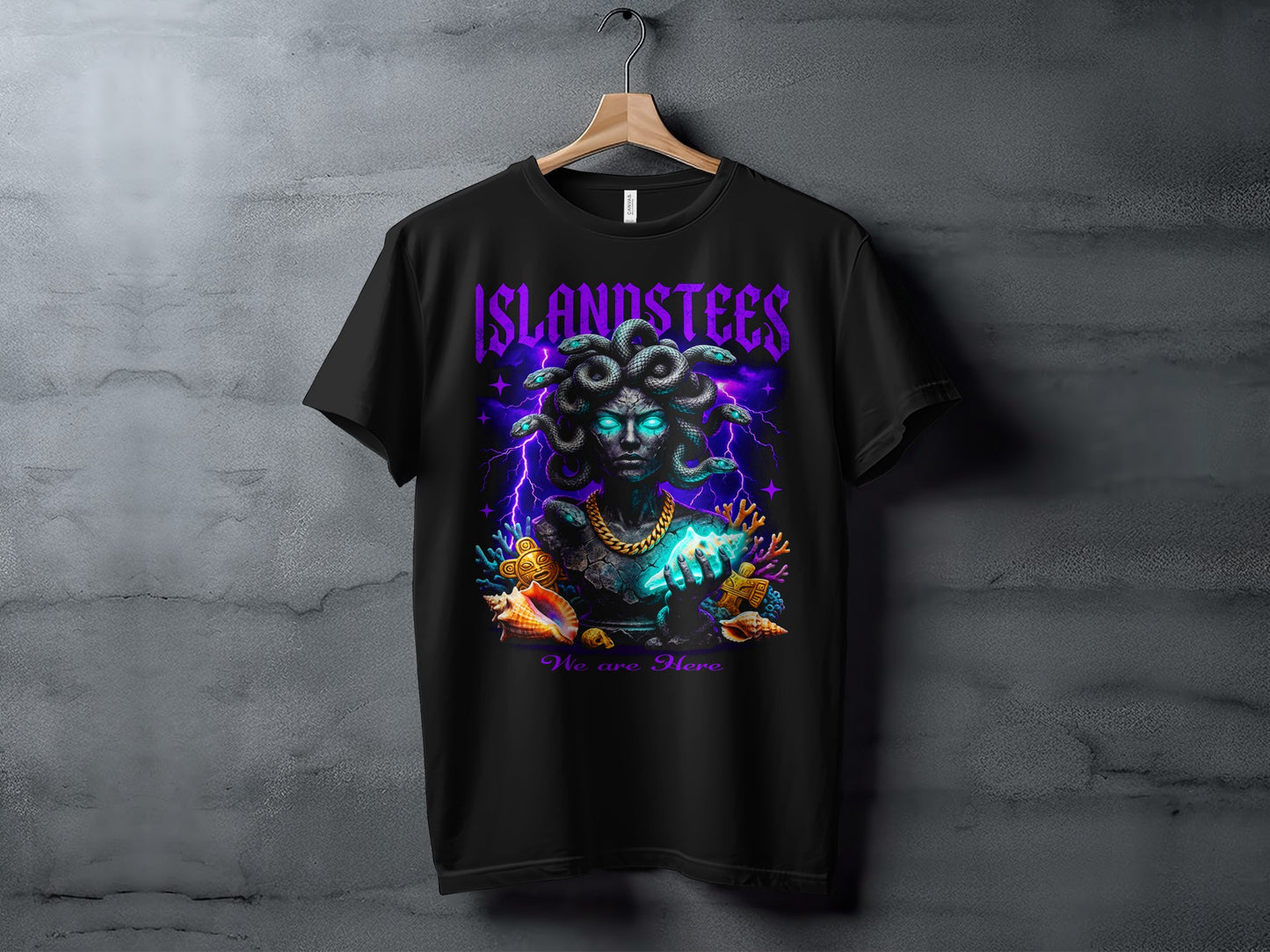 Black t-shirt with Medusa graphic, glowing eyes, and "ISLANDSTEES We are Here" text.