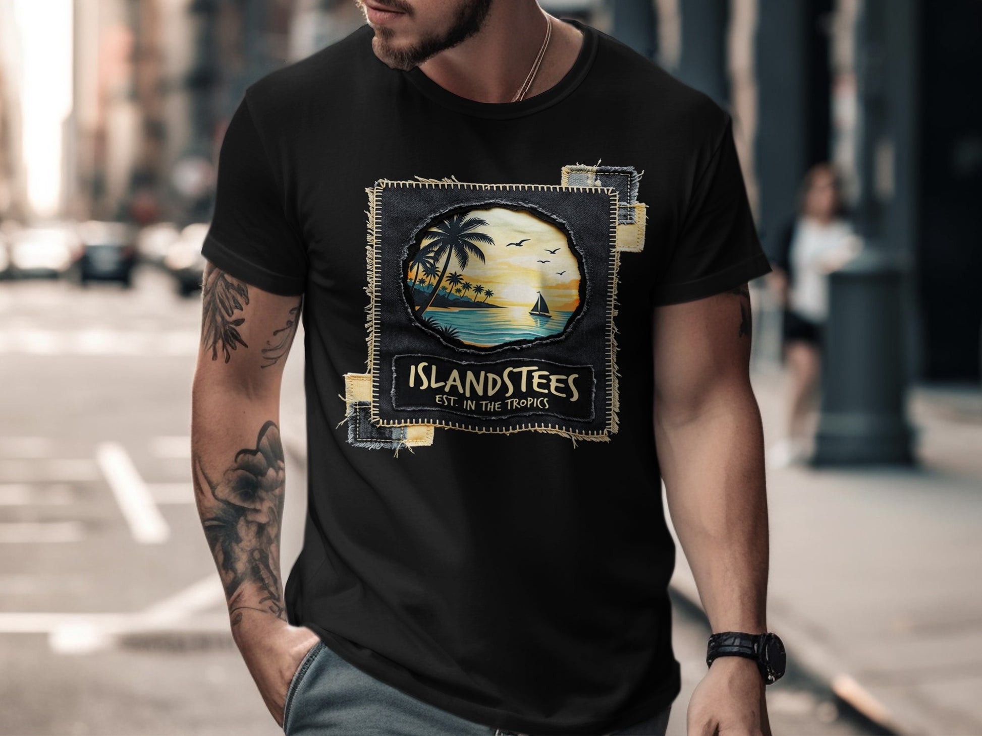 Black t-shirt with "ISLANSTEES EST. IN THE TROPICS" graphic depicting a tropical sunset scene.