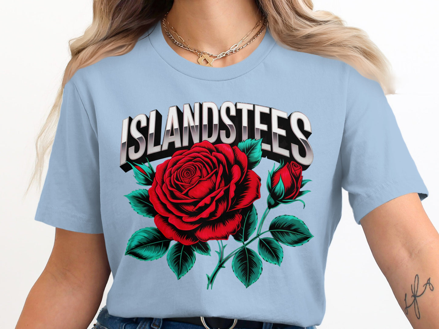 Light blue t-shirt with graphic of a red rose and the text ISLANDSTEES.