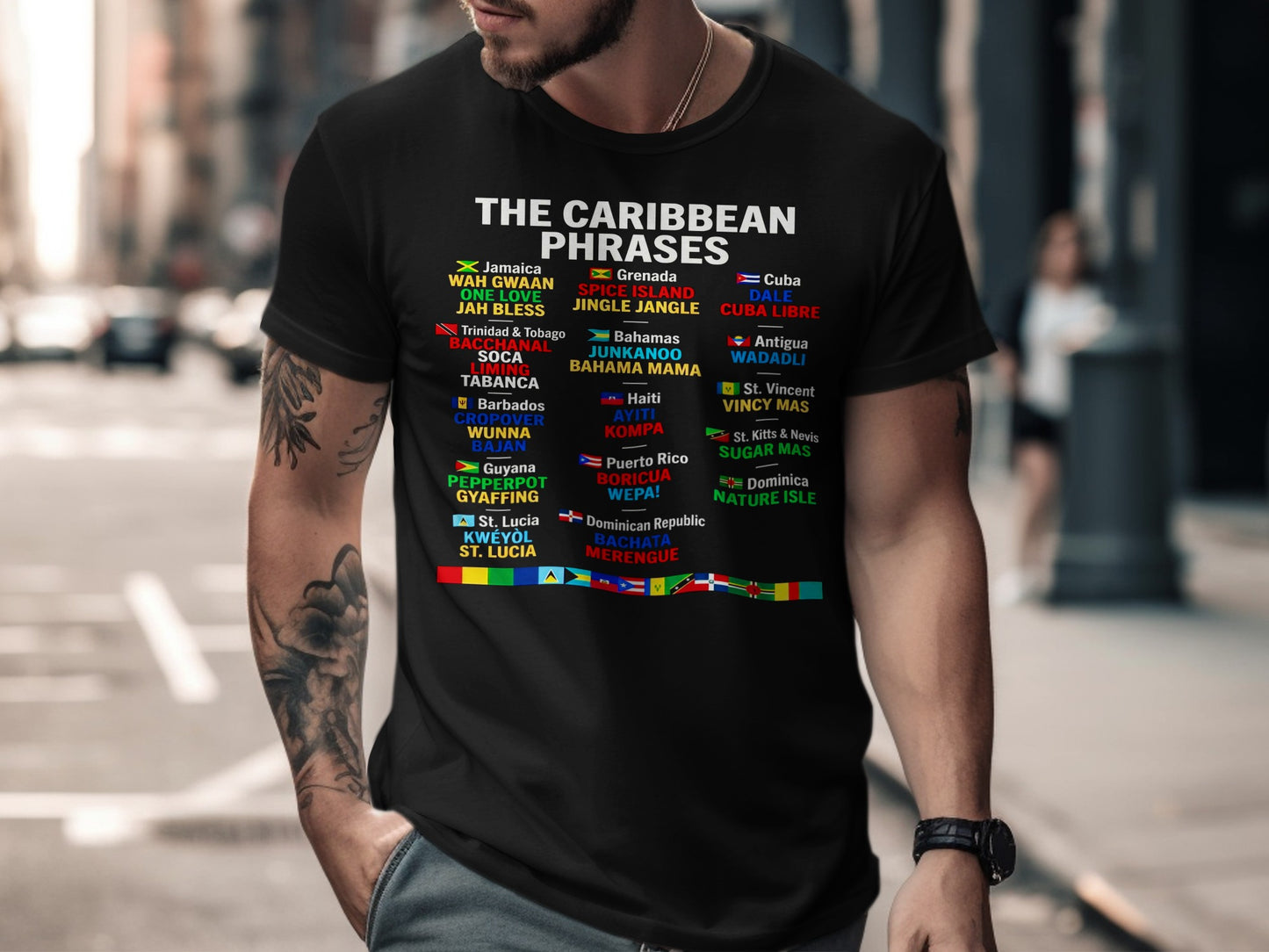 T-shirt featuring Caribbean phrases and flags, including Jamaica, Grenada, and Bahamas.