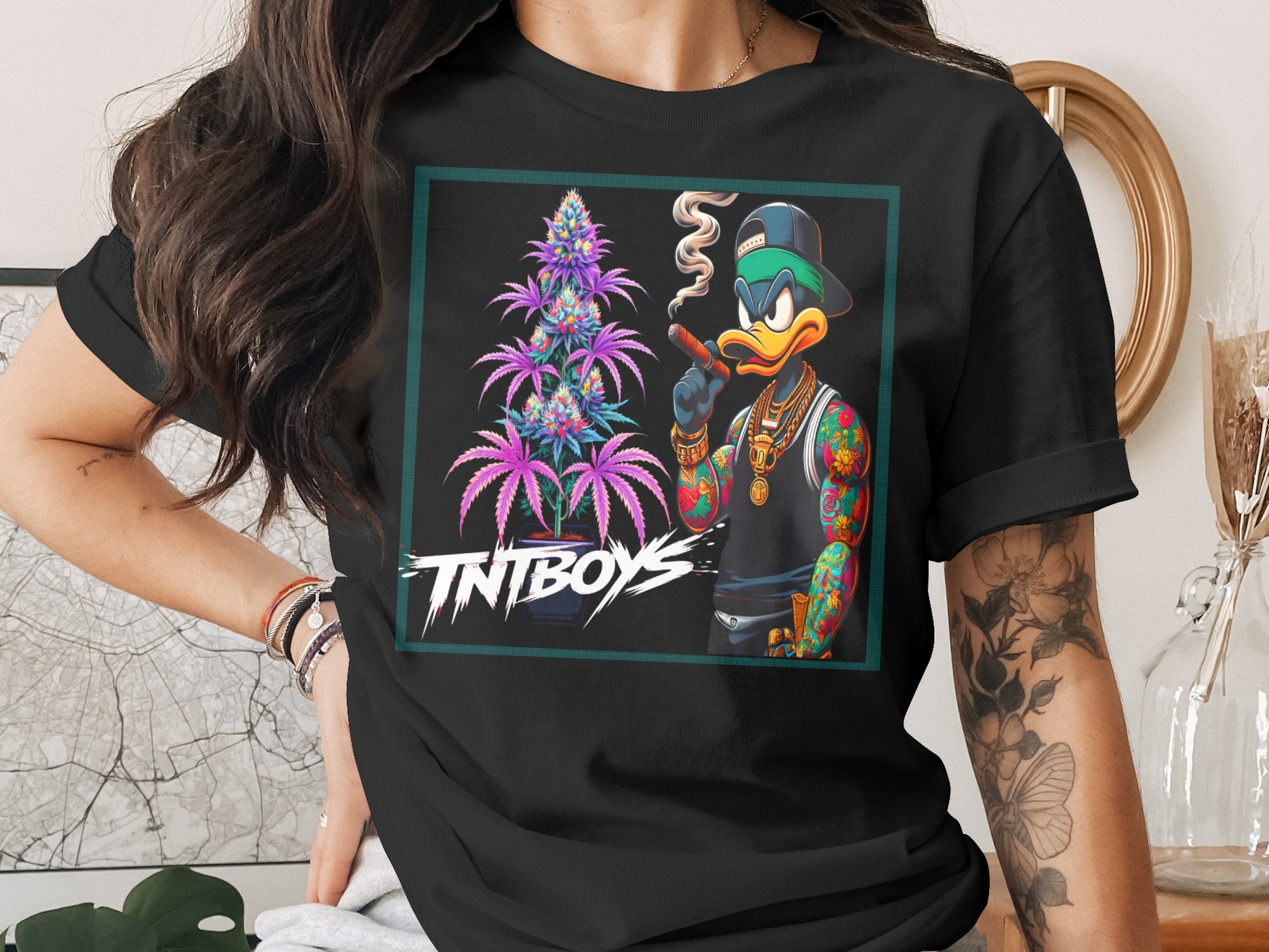 Black t-shirt featuring cartoon duck smoking a cigar with cannabis plant.