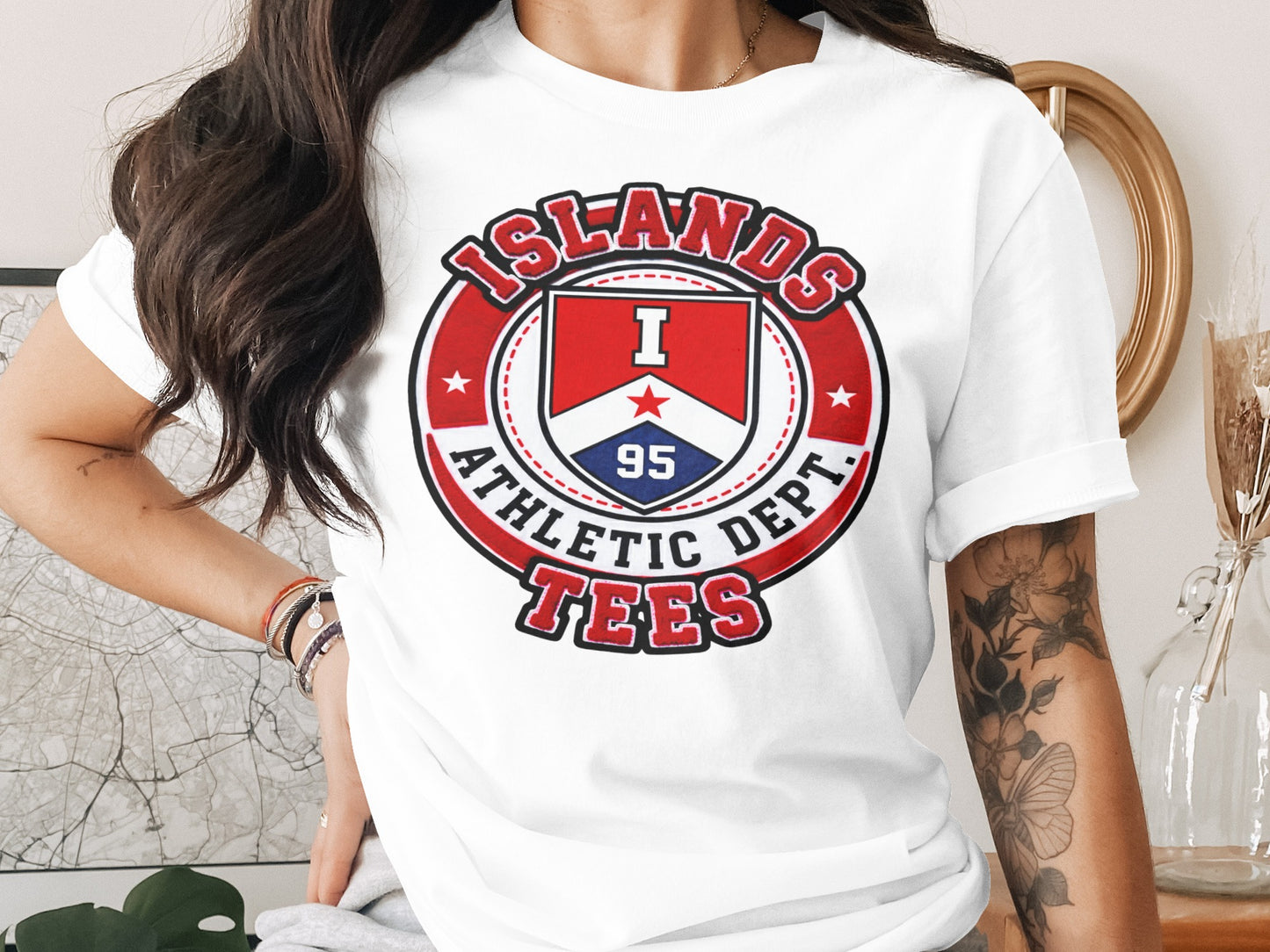 White t-shirt featuring a circular "ISLANDS ATHLETIC DEPT." logo with shield and "95".
