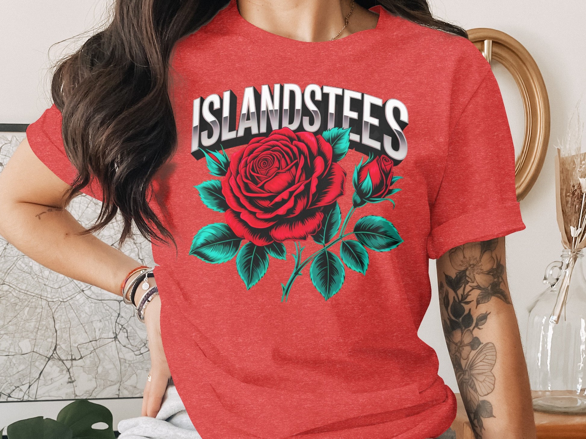 Red t-shirt with a large red rose graphic and "ISLANDSTEES" text.