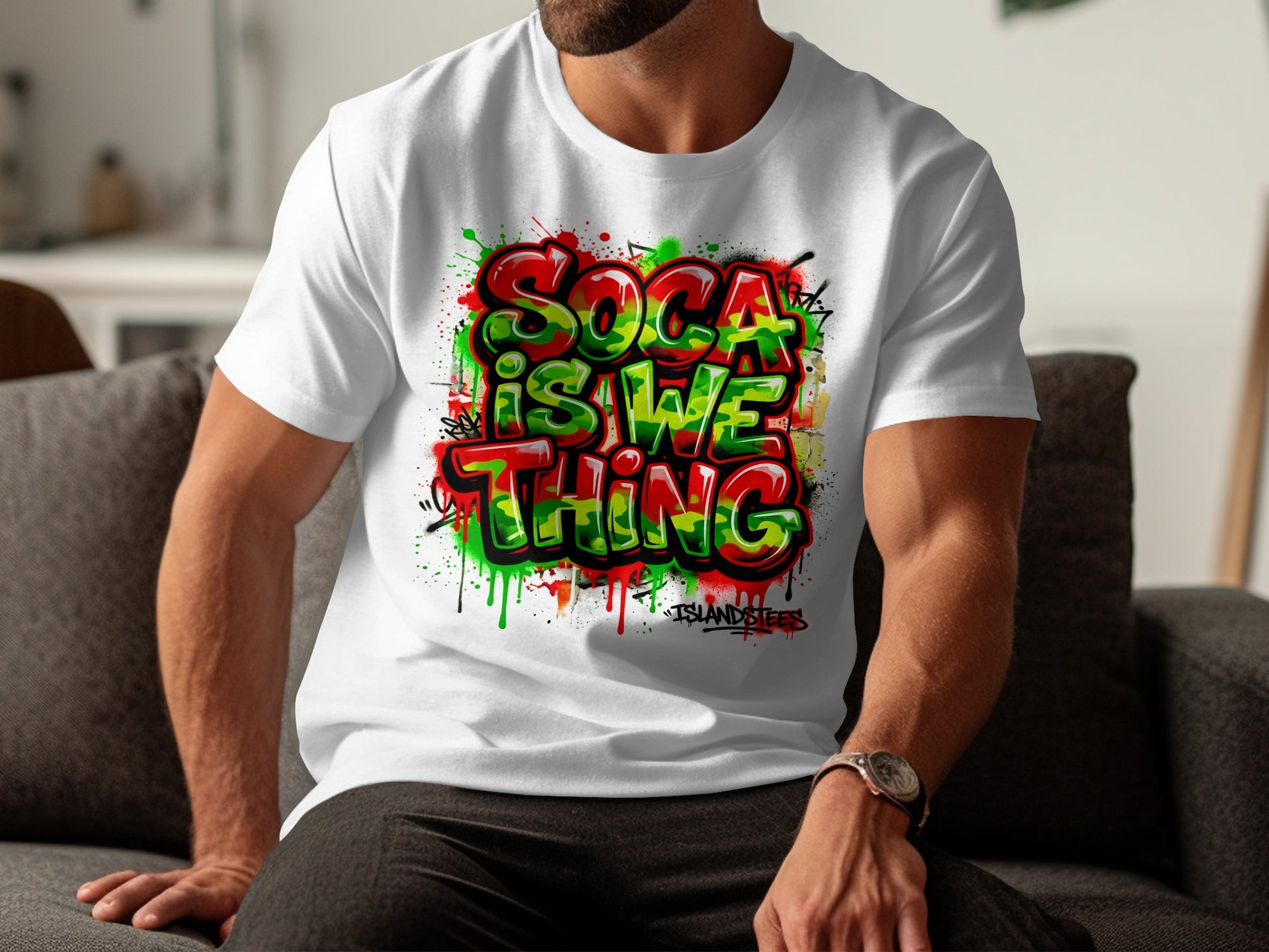 White t-shirt with "SOCA IS WE THING" graffiti-style text and colorful paint splatters.