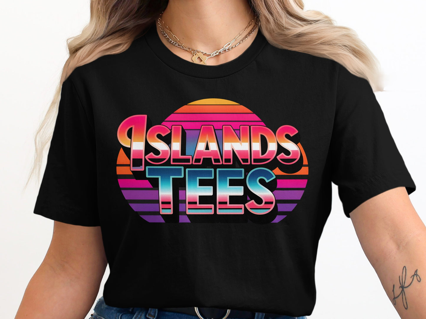 Black t-shirt with "ISLANDS TEES" in colorful, retro gradient text.
